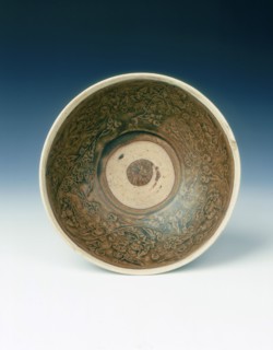 White rimmed celadon bowl with moulded peony scrolls, Jin dynasty, China, 13th century. Artist: Unknown