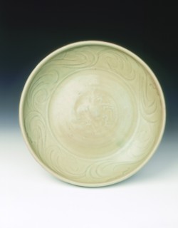 Celadon dish with moulded tree and incised scrolls, Yuan-Ming dynasty, China, 14th century. Artist: Unknown