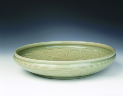 Celadon dish with moulded tree and incised scrolls, Yuan-Ming dynasty, China, 14th century. Artist: Unknown