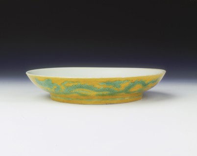 Yellow saucer with dragons in green enamel, Zhengde period, Ming dynasty, China, 1506-1521. Artist: Unknown