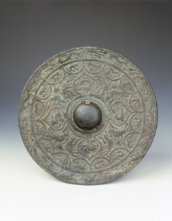 Bronze mirror with dragon and phoenix design, early Six Dynasties period, China, mid 3rd century. Artist: Unknown