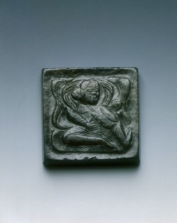 Mottled black jade square belt plaque with drummer in relief, Tang dynasty, China, 618-907. Artist: Unknown