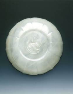 White jade bracketed saucer with two catfish and fungus in relief, Qing dynasty, mid 18th century. Artist: Unknown