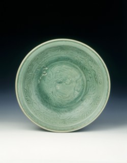 Shichikan celadon dish with phoenix and peonies, Ming dynasty, China, 16th century. Artist: Unknown