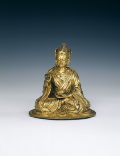 Gilt brass Padmasambhava holding attributes, Tibet, 16th-17th century. Artist: Unknown
