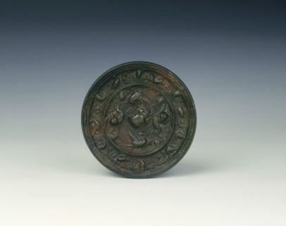 Bronze lion and grapevine mirror, Tang dynasty, China, 618-907 AD. Artist: Unknown