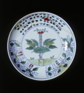 Doucai plate with pomegranate tree and floral groups, Qing dynasty, China, 1700-1722. Artist: Unknown