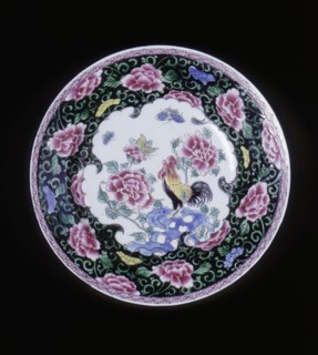 European copy of a Chinese famille noire plate with cockerel looking at a butterfly, 20th century. Artist: Unknown