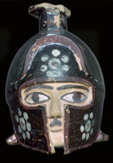 Terracotta scent-bottle in the shape of a helmeted head, Rhodes, Greece, c600-550BC. Artist: Unknown