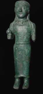Greek bronze figure holding a pomegranate. Artist: Unknown