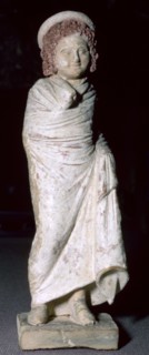 Greek terracotta figure of a boy, said to be from Tanagra, Boeotia, Greece, c300BC- 250BC. Artist: Unknown