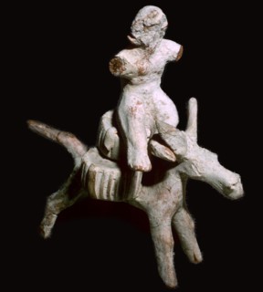 Greek terracotta figure of a man seated on three cheese on top of a mule, Corinthian. Artist: Unknown
