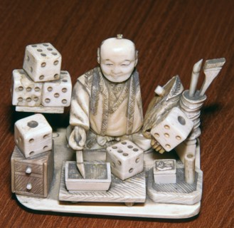 Japanese ivory of a dice painter, 19th century. Artist: Unknown