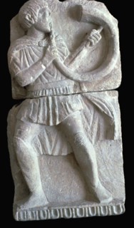 Detail from a Spanish frieze showing a man with a horn. Artist: Unknown