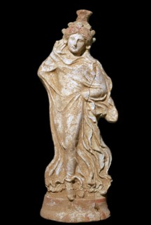 Greek terracotta of a woman in a flowing dress. Artist: Unknown