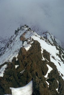 Climber on Crib Goch ridge on Snowdon.