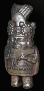 Incan silver figure of a man with pan-pipes. Artist: Unknown
