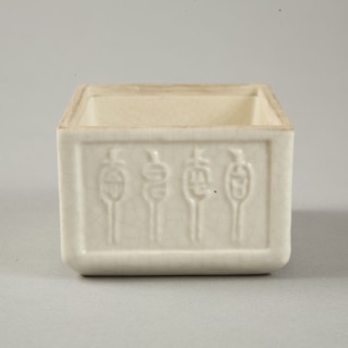 Soft paste rectangular vessel with characters in relief, early 19th century. Artist: Unknown.