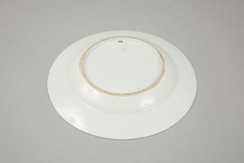 European copy of famille noire plate with cockerel looking at a butterfly, 20th century. Artist: Unknown.