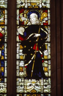 St. Hilda of Whitby holding an ammonite, West window, Hereford Cathedral, 20th century. Artist: CM Dixon.