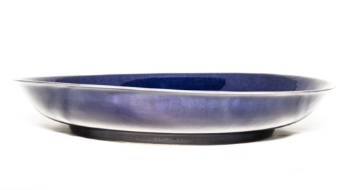 Deep aubergine dish with carved dragons chasing flaming pearl, 1662-1722. Artist: Unknown.