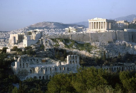 Acropolis and Theatre of Herodes Atticus, Athens from Philopappos Hill at dusk, c20th century. Artist: Unknown.