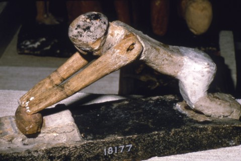 Wood Model of Woman Grinding Corn, Egyptian Tomb Finding, c1900 BC. Artist: Unknown.