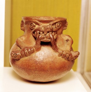 Pottery Bowl of an alligator with human arms devouring snakes, Chiriqui, Panama. Artist: Unknown.