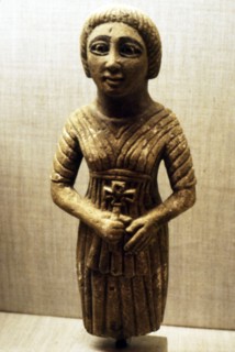 Coptic figure of woman clasping a crucifix, Sheik Ibada, Upper Egypt, 350-400. Artist: Unknown.
