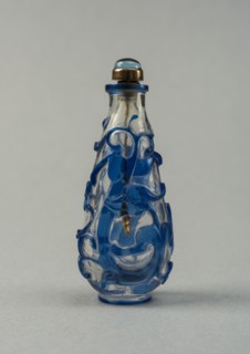 Clear glass snuff bottle with blue overlay, China, Qing dynasty, 1644-1911. Creator: Unknown.