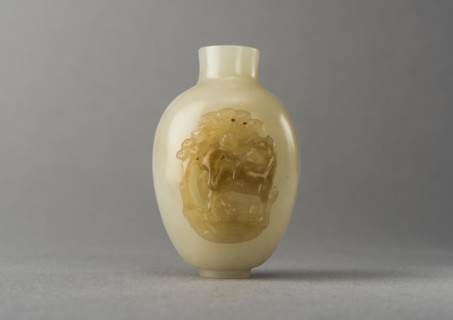 Jade snuff bottle with raised carving of animals, China, Qing dynasty, 1644-1911. Creator: Unknown.