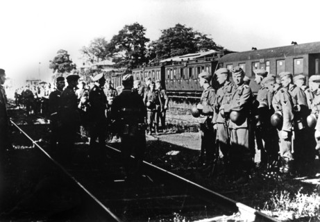 German soldiers awaiting transportation in a railway station in the Paris suburbs, August 1940. Artist: Unknown