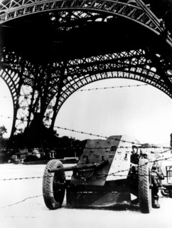 Barbed wire and anti-tank gun beneath the Eiffel Tower, German-occupied Paris, 1940-1944. Artist: Unknown