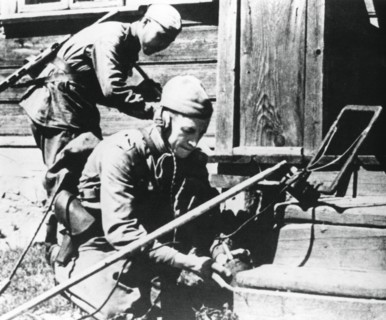 Russian soldiers with mine detectors clearing a booby-trapped house, Eastern Front, 1944. Artist: Unknown