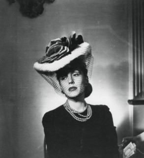 Woman wearing a hat and veil by the French fashion designer Jacques Fath, France, 1943. Artist: Unknown