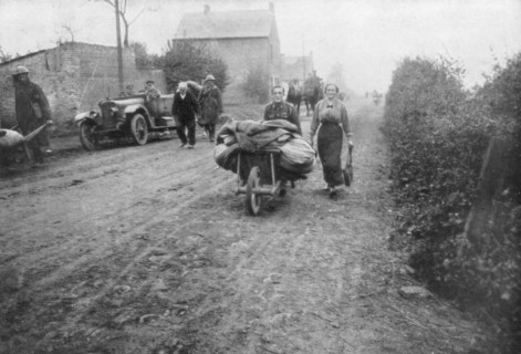 A British soldier helping a woman return to her village, France, 1918. Artist: Unknown
