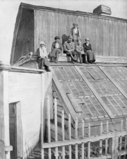 Tsar Nicholas II and his children sitting on a greenhouse, Tobolsk, Siberia, Russia, 1917. Artist: Unknown