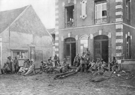 German troops sitting on the steps of the Vareddes Town Hall, France, 1914. Artist: Unknown