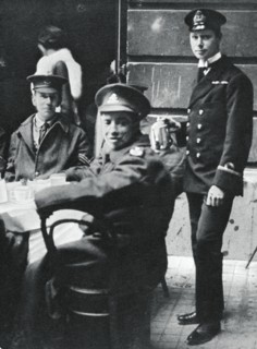 Sub-Lieutenant Prince Albert serving tea to wounded soldiers at Buckingham Palace, 1916. Artist: Unknown