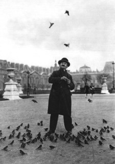 A bird charmer, Paris, 1931.Artist: Ernest Flammarion