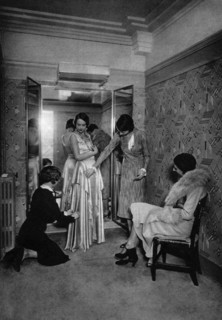 Trying on a dress at a great dressmakers, Paris, 1931.Artist: Ernest Flammarion
