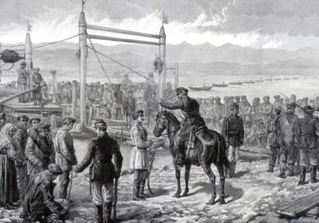Russian convicts under military escort waiting to be ferried across the river Yenisei, Siberia, 1882 Artist: Unknown