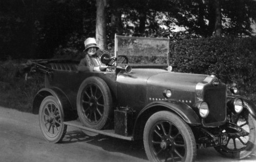 Woman driving a car, 1930. Artist: Unknown