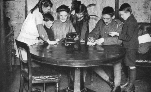 Children emptying their money boxes to invest in war bonds, 1936. Artist: Unknown
