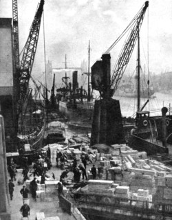 Cargo being unloaded at the docks, Upper Pool, London, 1936.Artist: Fox