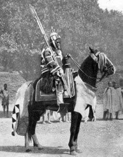 Royal bodyguard in ancient armour, northern Nigeria, 1936.Artist: Wide World Photos