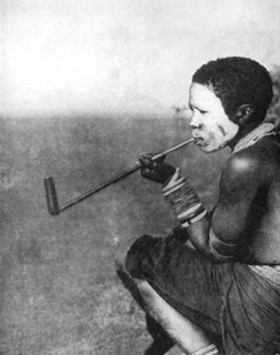 A South African tribesman smoking, 1936.Artist: South African Railways