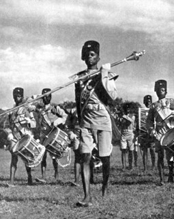 Bandsmen of the Northern Rhodesia Regiment beat a military tattoo, Zimbabwe, Africa, 1936.Artist: LNA Images