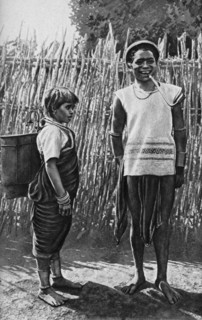 A Moi couple inside the village palisade, Africa, 1922. Artist: Unknown