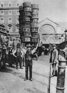 A man carrying many baskets on his head, Covent Garden, London, 1926-1927. Artist: Unknown